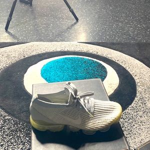 Vapor max grey in color lace up the front
